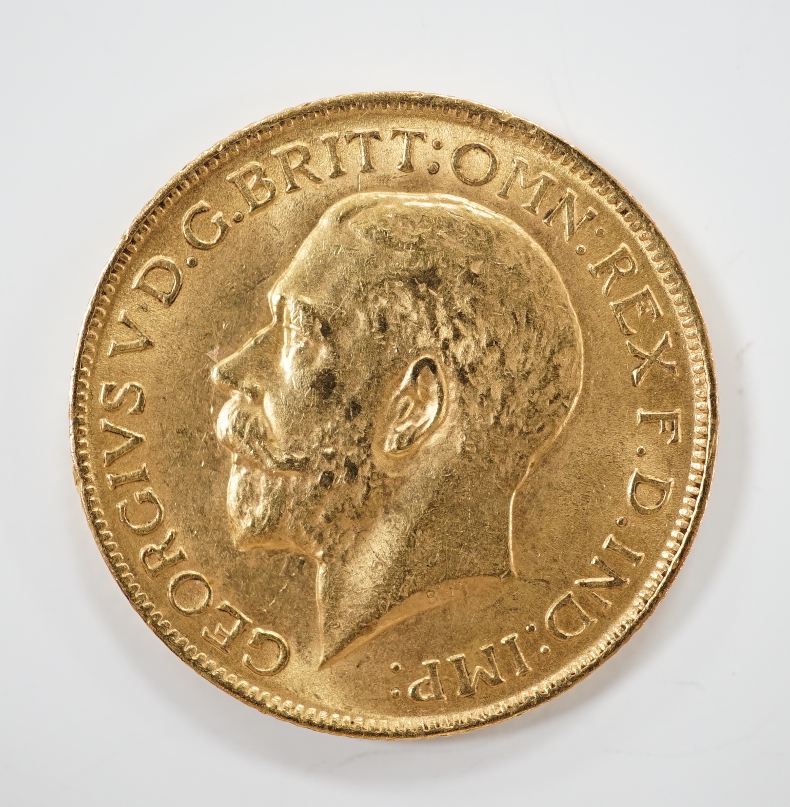 A George V 1915 gold sovereign.